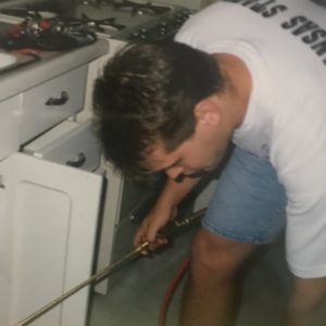 Jeremiah treating a home for pest control in the mid 1990s