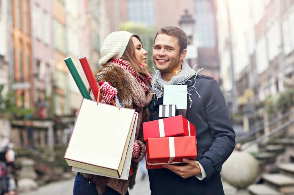 Happy couple shopping for Christmas in Kansas City, Missouri.