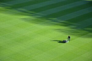 A man aerating a lawn